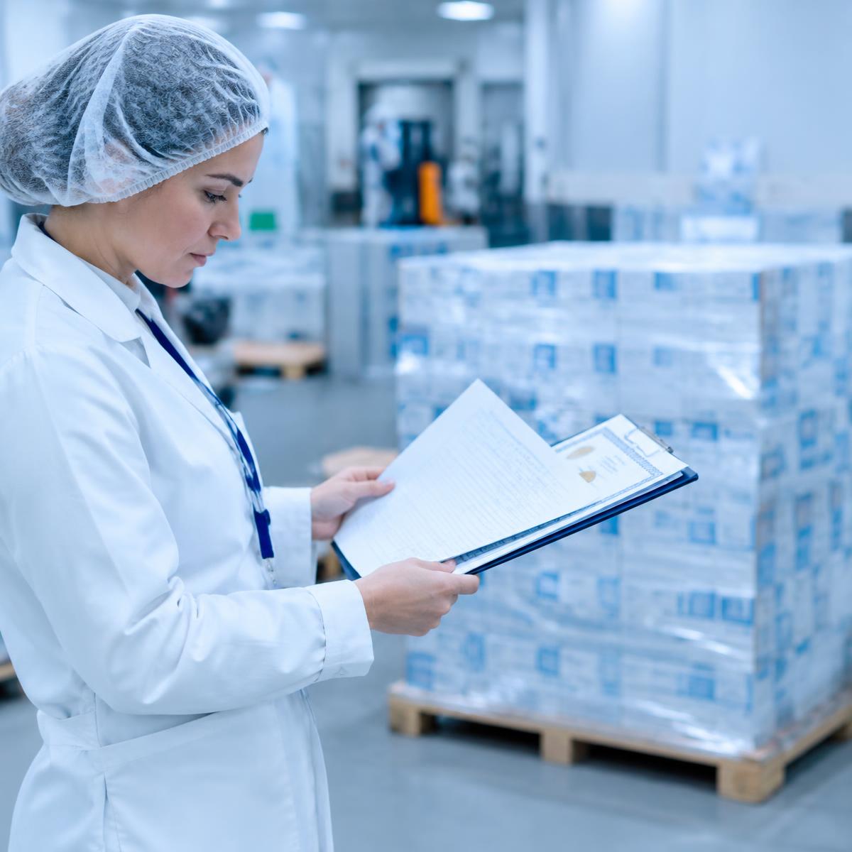 Qualified Person reviewing batch documentation before EU market release.